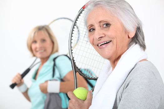 Women going to play tennis