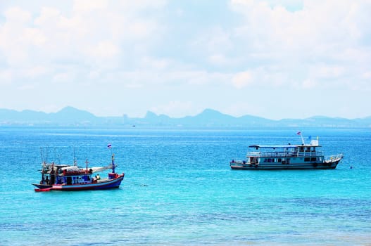 Fishing boat and traveller boat at Lahn island, Thailand