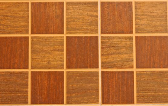 brown ceramic tiled floor background with space for text or image