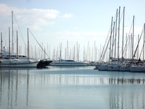 harbor with yachts in blue water