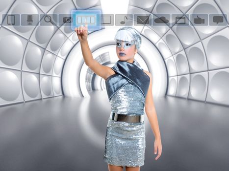 futuristic kid girl in silver touching finger icons on glass transparent holographic screen