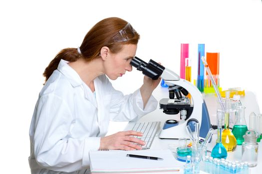 chemical laboratory scientist woman looking at microscope on white desk