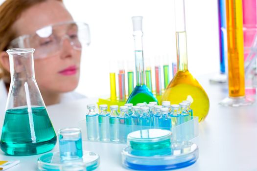 chemical laboratory scientist woman working with test tubes and flask