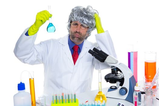 Crazy nerd scientist silly man gray hair on chemical laboratory