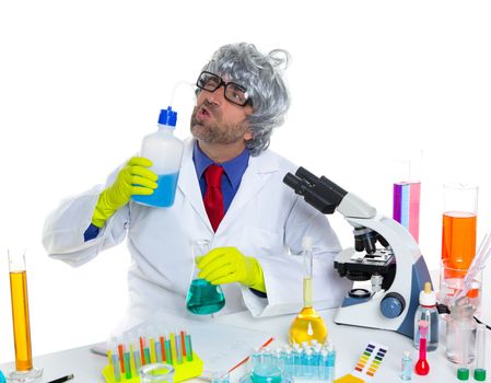 Crazy silly nerd scientist drinking chemical experiment liquid at laboratory