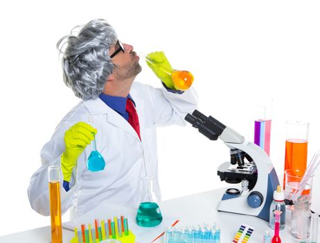 Crazy silly nerd scientist drinking chemical experiment liquid at laboratory