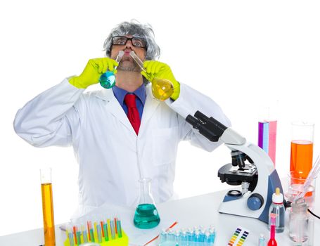 Crazy silly nerd scientist drinking chemical experiment liquid at laboratory