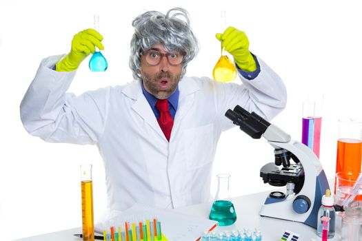 Crazy nerd scientist silly man gray hair on chemical laboratory