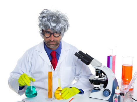 Nerd crazy scientist man portrait working at laboratory with gray hair