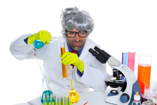 Crazy nerd scientist silly man gray hair on chemical laboratory