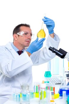 laboratory scientist working at lab with test tubes and microscope