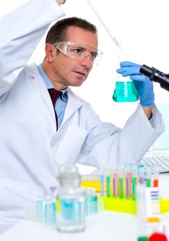 laboratory scientist working at lab with test tubes and microscope