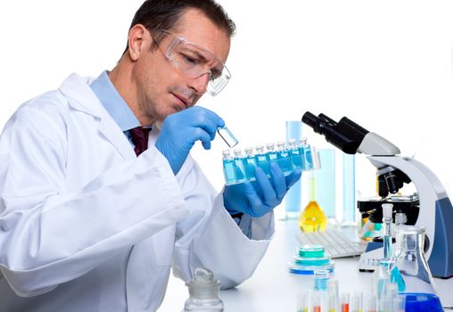 laboratory scientist working at lab with test tubes and microscope