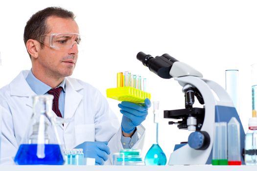 laboratory scientist working at lab with test tubes and microscope