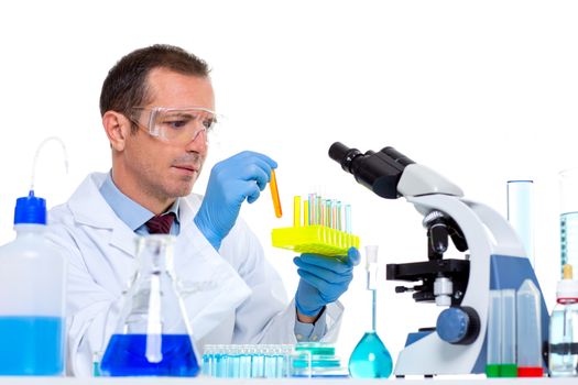 laboratory scientist working at lab with test tubes and microscope