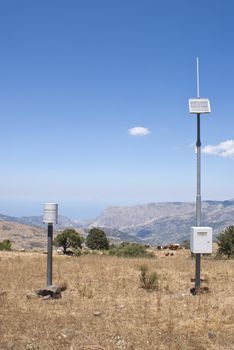 hydrometeorological station in the mountains of  Nebrodi park. mountains and cows in the background