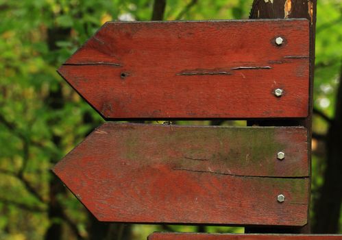 Two wooden arrow road signs