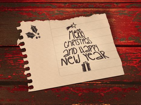 Vintage Merry Christmas and happy new year message in paper note over wooden background. Included clipping path, so you can easily cut it out and place over the top of a design.