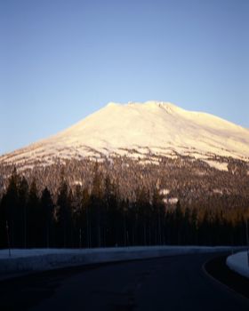 Highway passing near majestic snow capped mountain in Cascades range in Oregon
