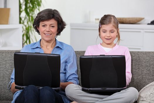 Mother and daughter have their own laptops