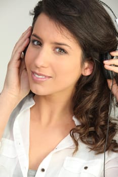 Brunette listening to music