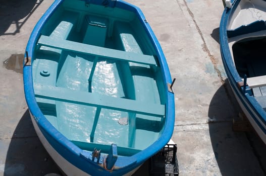 Blue boat on the land