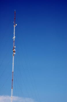 antenna tower soaring into the blue sky
