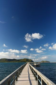 concrete jetty with railing over sea at Sattaheep beach, Thailand