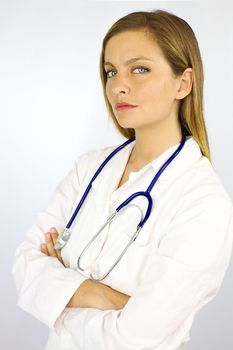 Good looking female model dressed with doctor uniform serious