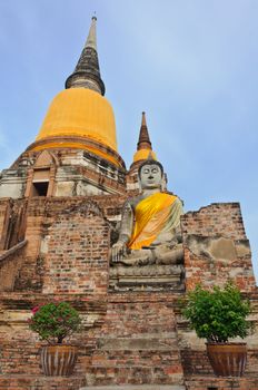 The big ancient buddha statue in ruined old temple at Wat Yai Chai Mongkol temple, Ayutthaya, Thailand