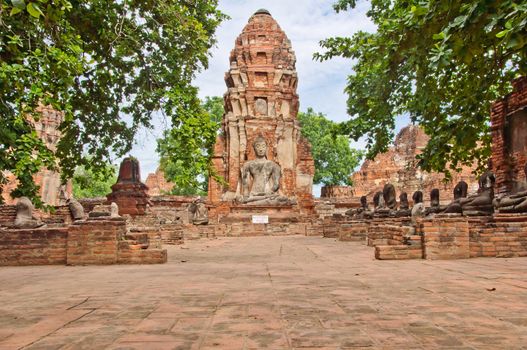 The big ancient buddha statue in ruined old temple at Ayutthaya historical park, Thailand