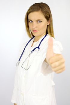 Serious woman doctor thumb up isolated