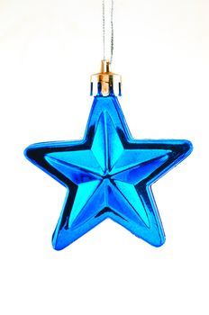 Blue five-pointed star toy Christmas tree against a white background