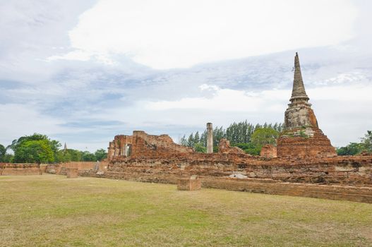 Ancient pagoda in ruined old temple at Ayutthaya historical park, Ayutthaya, Thailand.