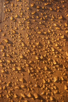 Wet wooden varnished board rain drops as background
