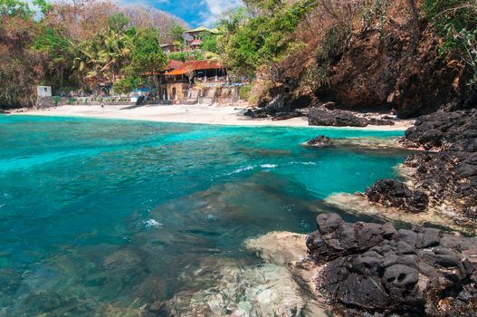 Small hotell on tropical beach. Padangbai, Bali, Indonesia.