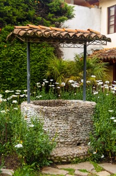 An old abandoned well in a beautiful courtyard