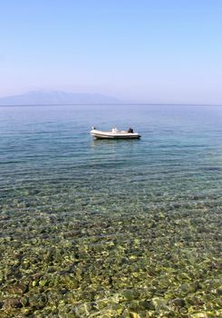 Clear sea water of Adriatic sea and small boat, Croatia