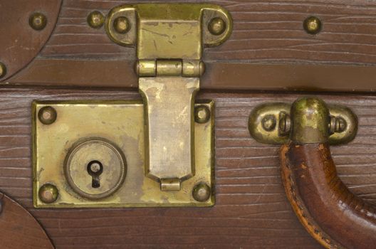 old suitcase lock, leather and brass