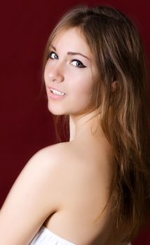 Young cute woman on a red background