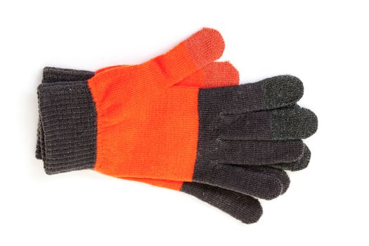 Red-black knitted gloves, on white background
