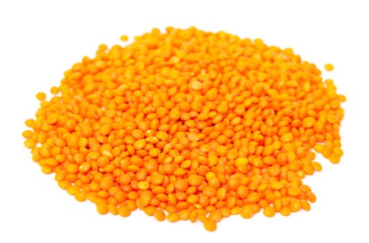 Heap of orange lentil, isolated on white background