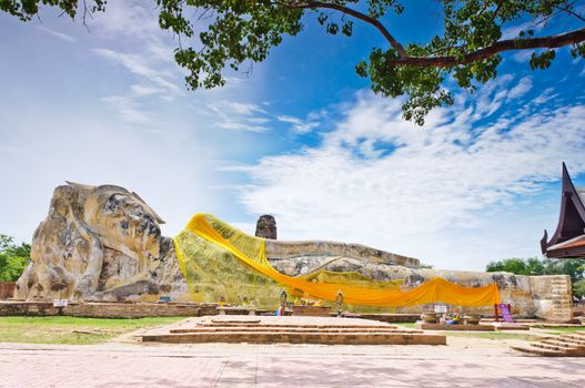 Ancient sleeping buddha statue at Wat Lo Ka Ya Su Tha temple in Ayutthaya, Thailand