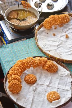 Powder fried dessert sold on the floating market in Ayuthaya, Thailand