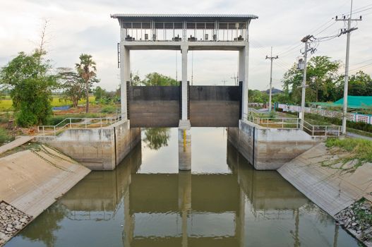 Water and dam gate in an irrigation canal, countryside of Pathumtanee, Thailand