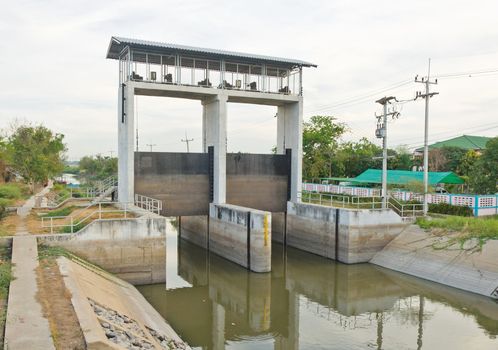 Water and dam gate in an irrigation canal, countryside of Pathumtanee, Thailand