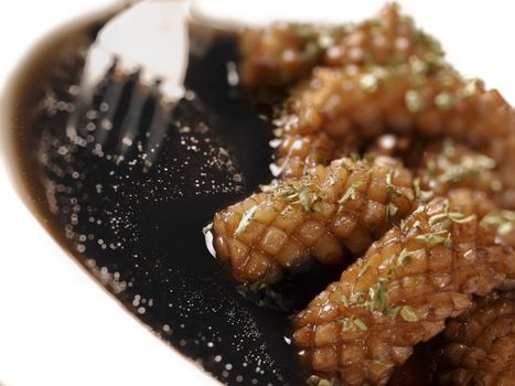 close up of a plate of black ink squid