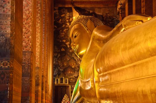 Reclining buddha statue at Wat Pho temple public place, Bangkok, Thailand