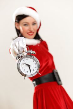 excited girl with santa hat holding clock. illustration