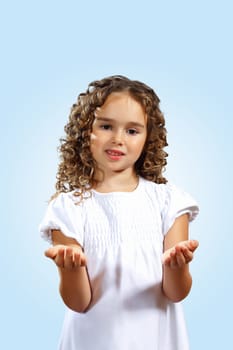 Portrait of an adorable preschool age girl wearing a Christmas holiday outfit